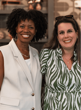Darryll Stinson with a woman at an event, smiling and engaging.