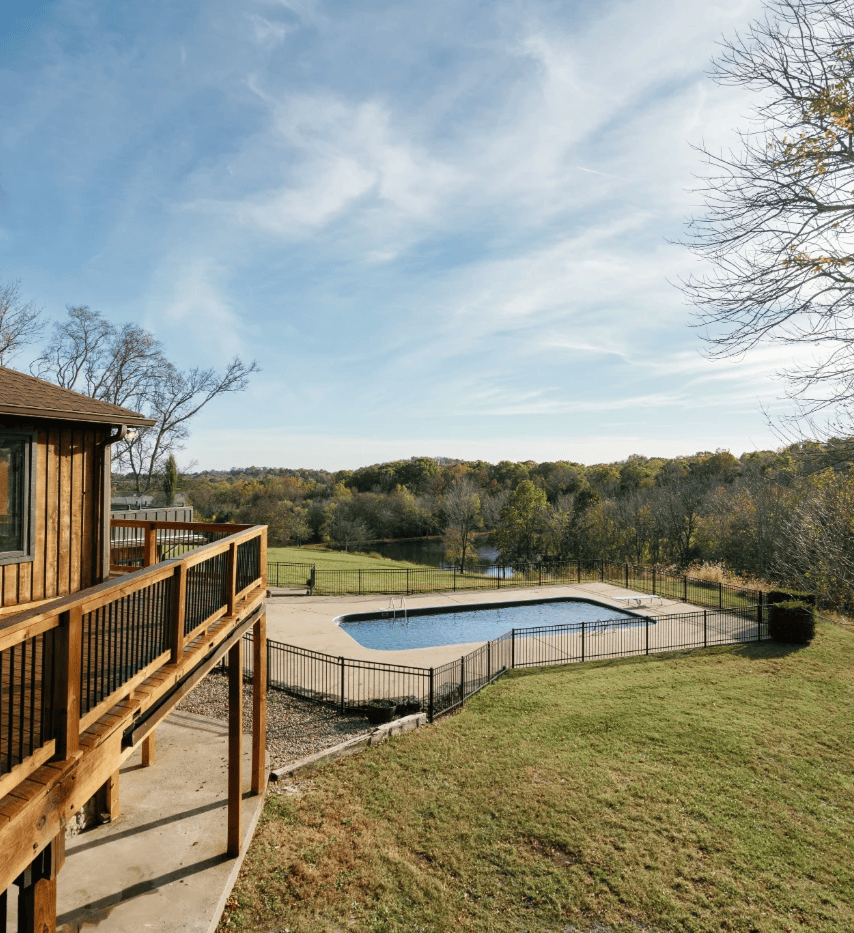 Outdoor pool at Darryll Stinson event venue with scenic countryside view.